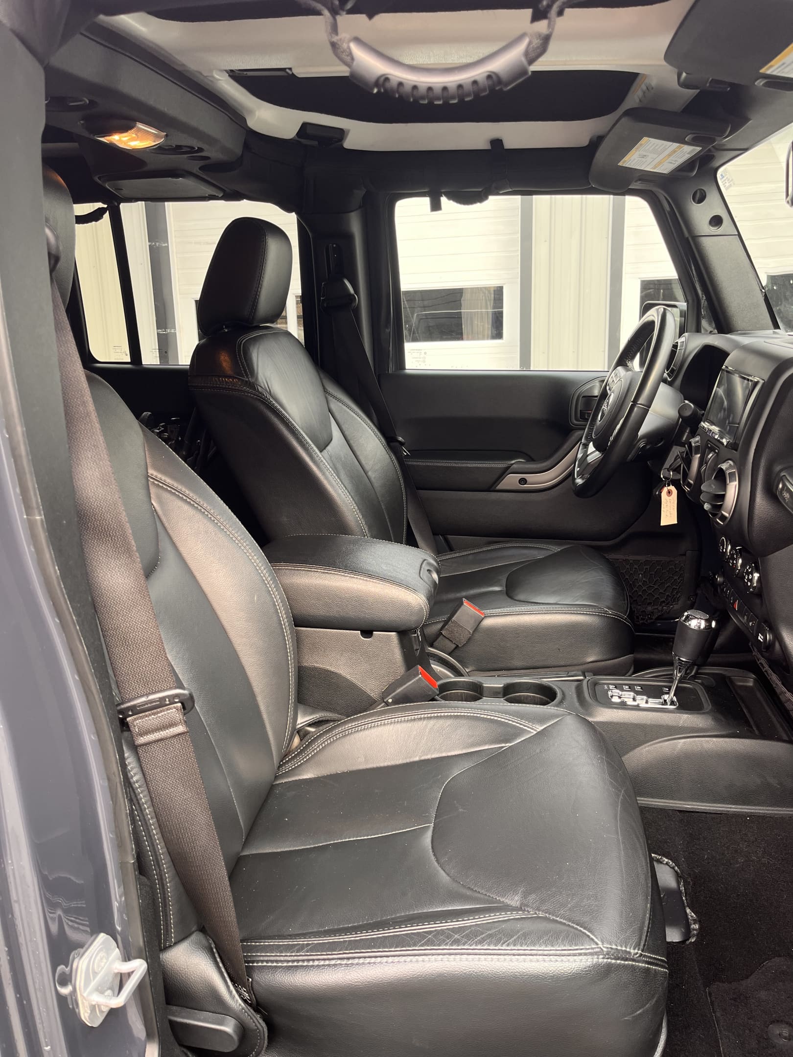 NEW ARRIVAL!!! 2018 JEEP UNLIMITED ALTITUDE!!! One owner car!! Loaded with heated leather seats, alpine 9 speakers with all weather subwoofer, power bulge hood, body color freedom hardtop, premium black sunrider soft top, hard top headliner, Bluetooth, backup camera and much more!! Best of all ONLY 39k miles!!! Won’t last at only $28,900!!
