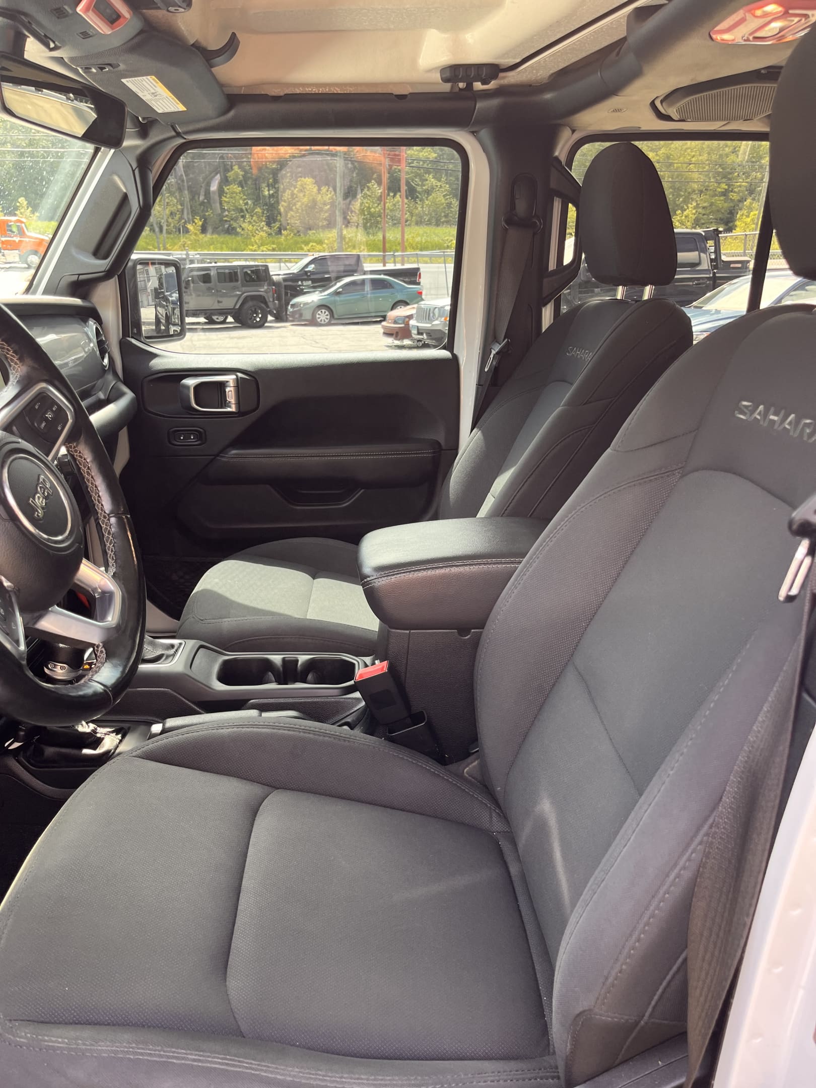 NEW ARRIVAL!! 2021 JEEP WRANGLER UNLIMITED SAHARA!! One owner!! ONLY 47,700 miles!! All the right options!! Navigation, back up camera, remote start, heated seats, heated steering wheel, Alpine premium sound and much more!! Also comes with a soft top!! Won’t last at $33,900!!