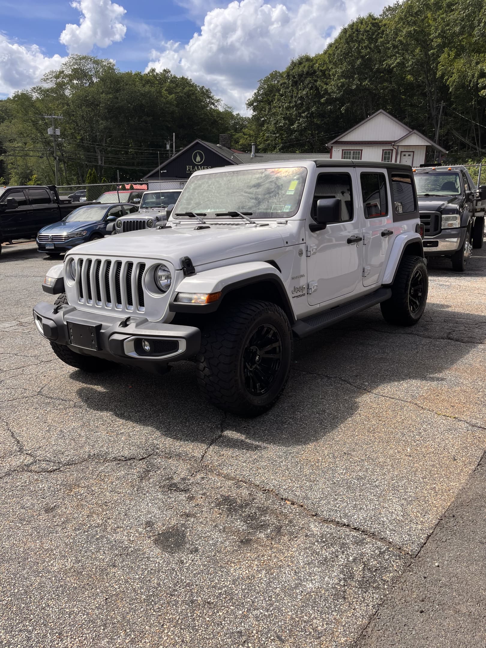 NEW ARRIVAL!! 2021 JEEP WRANGLER UNLIMITED SAHARA!! One owner!! ONLY 47,700 miles!! All the right options!! Navigation, back up camera, remote start, heated seats, heated steering wheel, Alpine premium sound and much more!! Also comes with a soft top!! Won’t last at $33,900!!