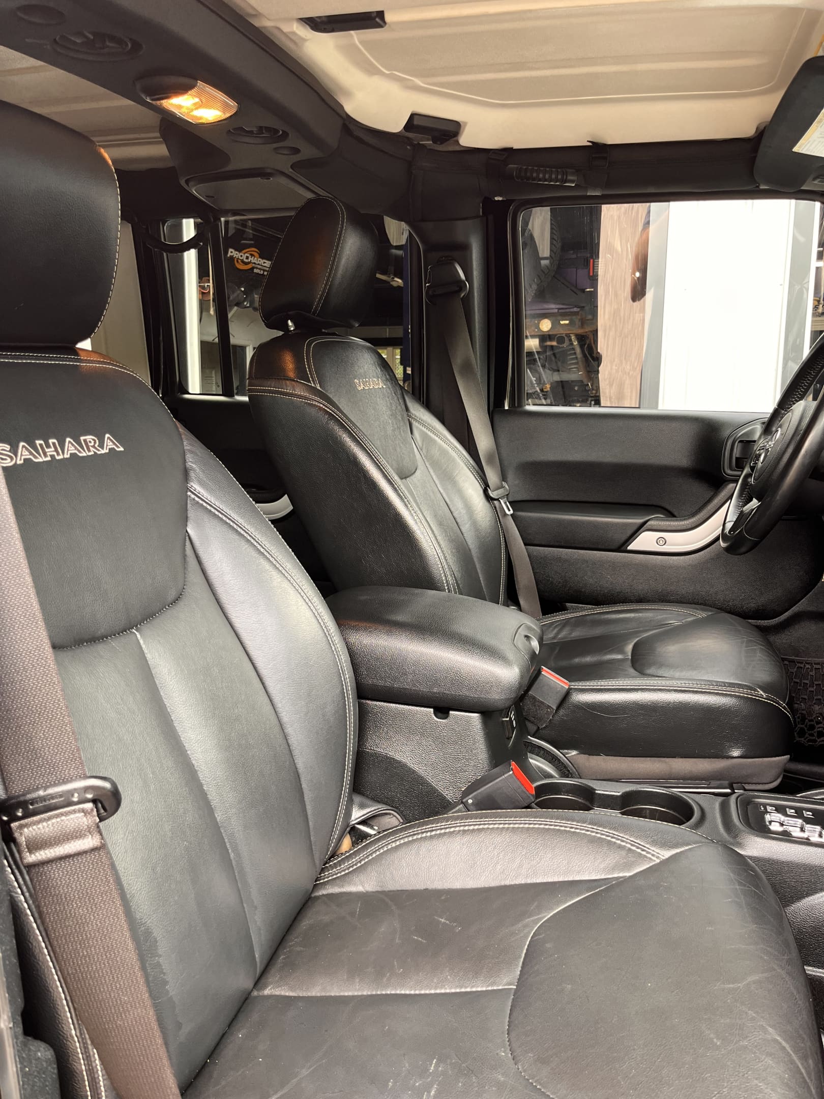 NEW ARRIVAL!!! 2016 JEEP WRANGLER UNLIMITED SAHARA!!! This one is one of a kind! Heated leather seats, color matching freedom hardtop, remote start, Bluetooth and much more!! 93k miles! Runs and drives like new! Too many mods to list!! All work done here at Rob’s!!! Won’t last at ONLY $22,900!!!