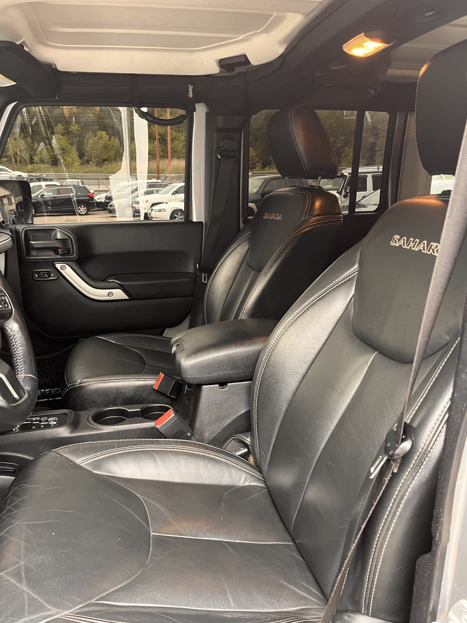 2016 JEEP WRANGLER UNLIMITED SAHARA!! Runs and drives great!! Heated leather seats! Backup camera! Remote start and much more! Only 100,400 miles! Recent wheels, tires and lift!! Won’t last at ONLY $19,900!!