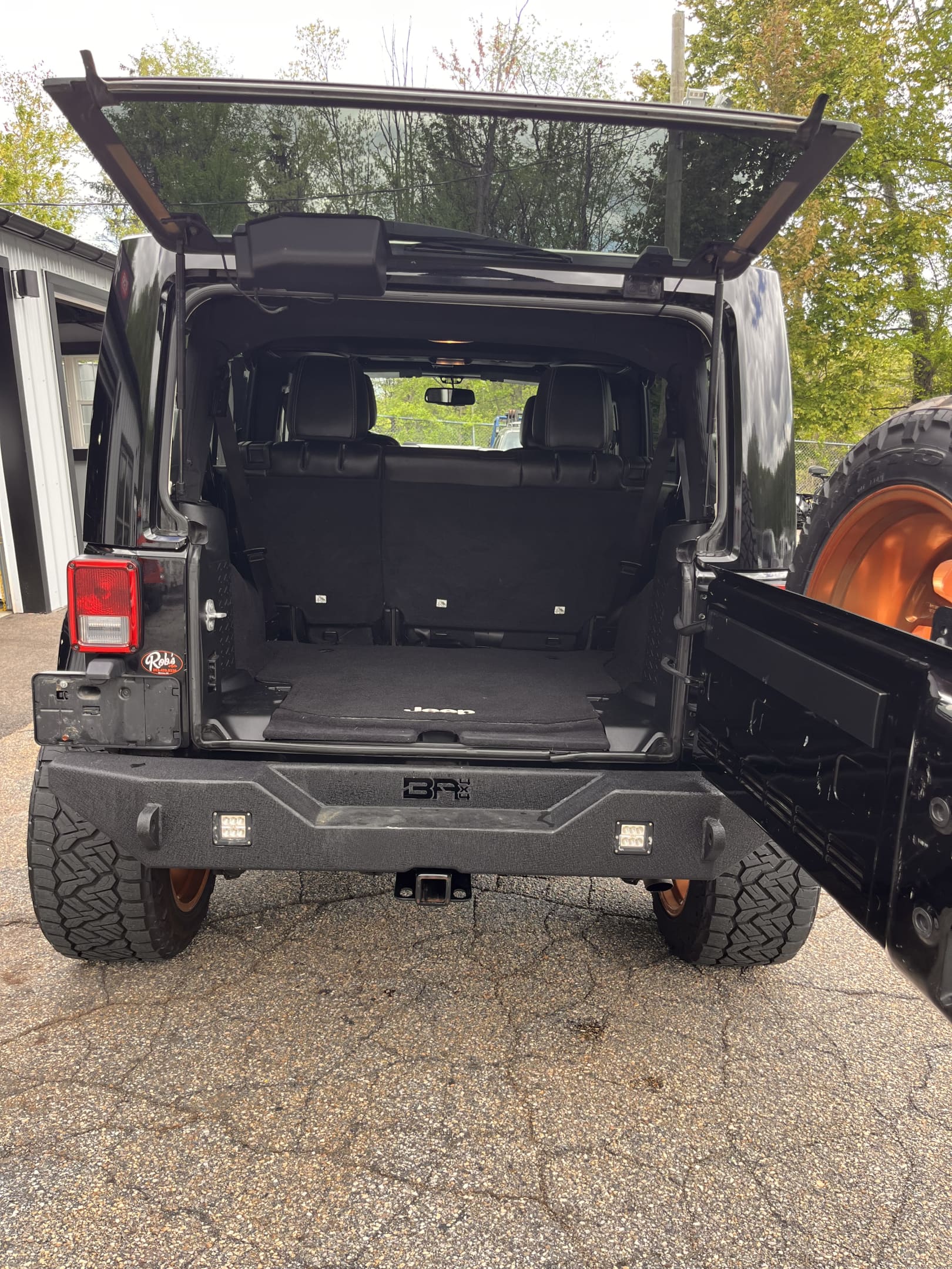 NEW ARRIVAL!!! 2016 JEEP WRANGLER UNLIMITED SAHARA!!! This one is one of a kind! Heated leather seats, color matching freedom hardtop, remote start, Bluetooth and much more!! 93k miles! Runs and drives like new! Too many mods to list!! All work done here at Rob’s!!! Won’t last at ONLY $22,900!!!